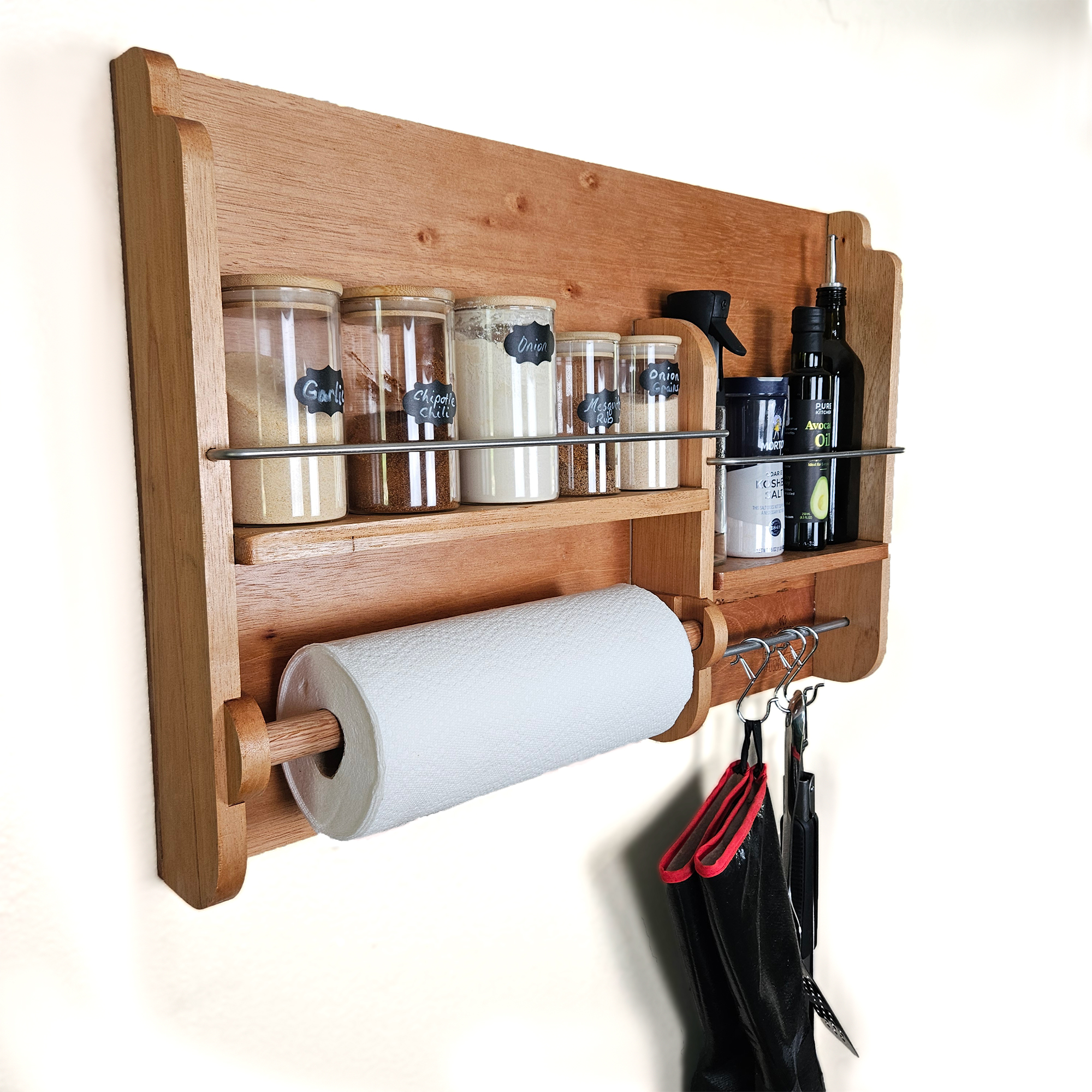 Cedar spice rack mounted on wall holding BBQ rubs