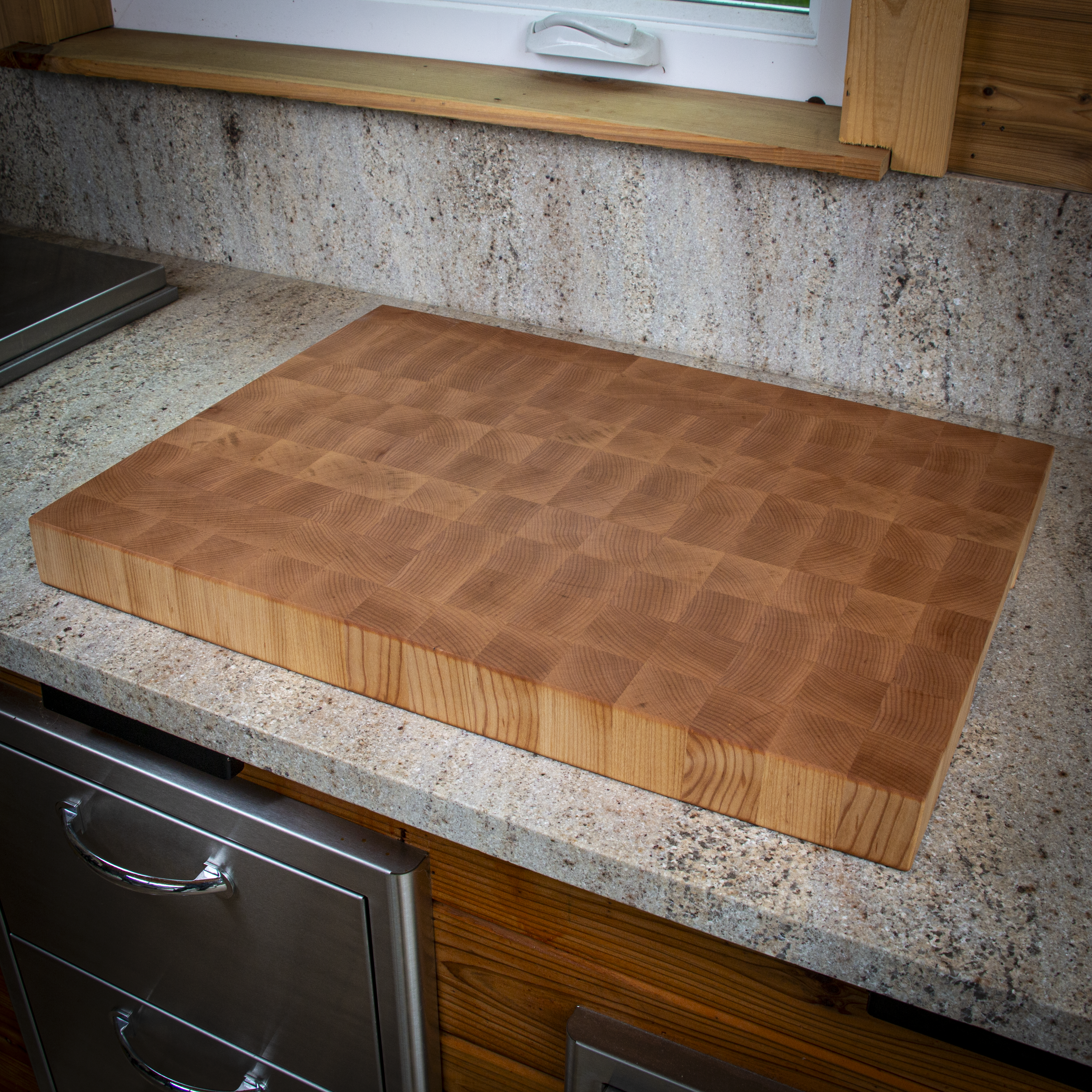 Large end grain maple cutting board for heavy prep and serving