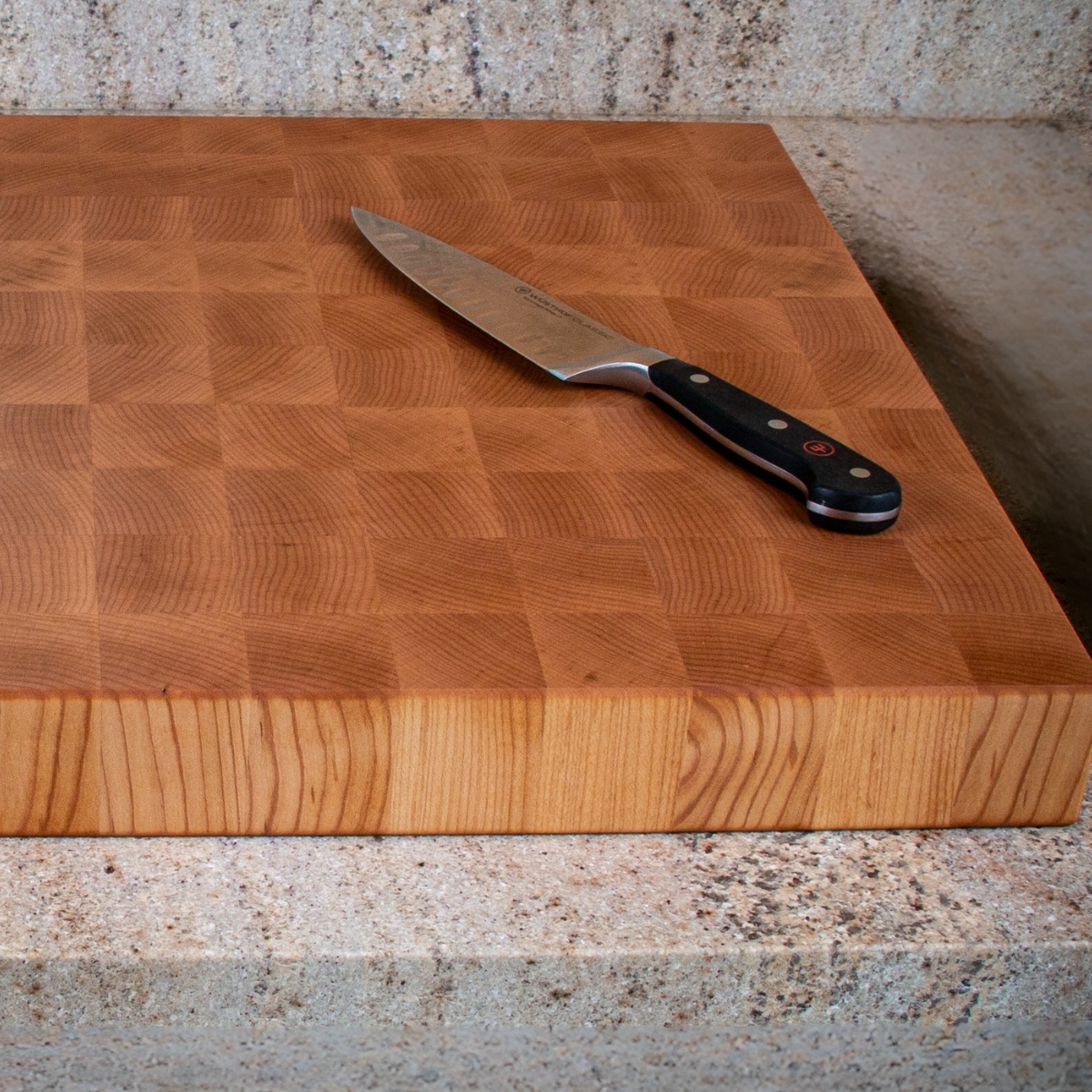 Large end grain maple cutting board for heavy prep and serving