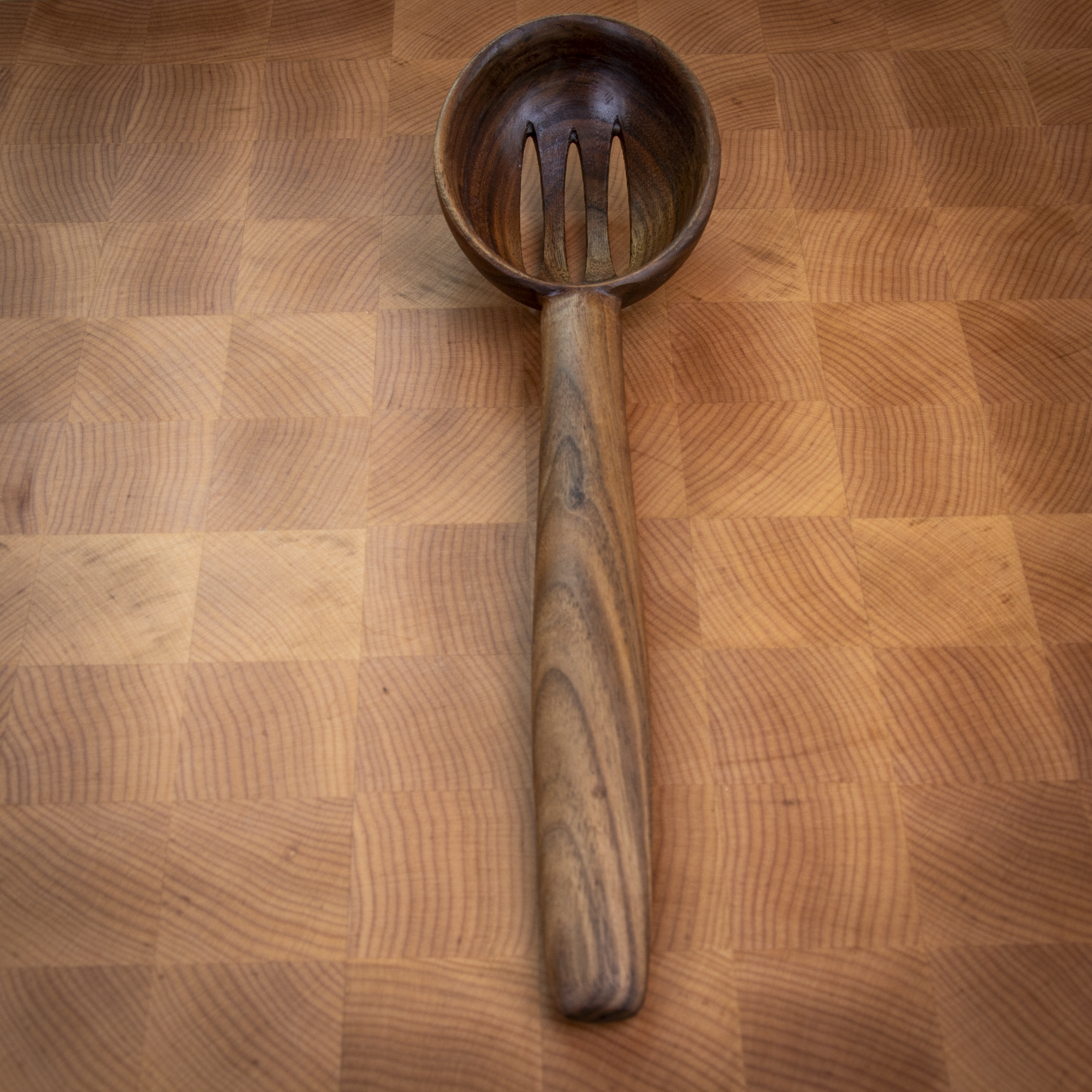 Large slotted wooden cooking spoon for draining and stirring