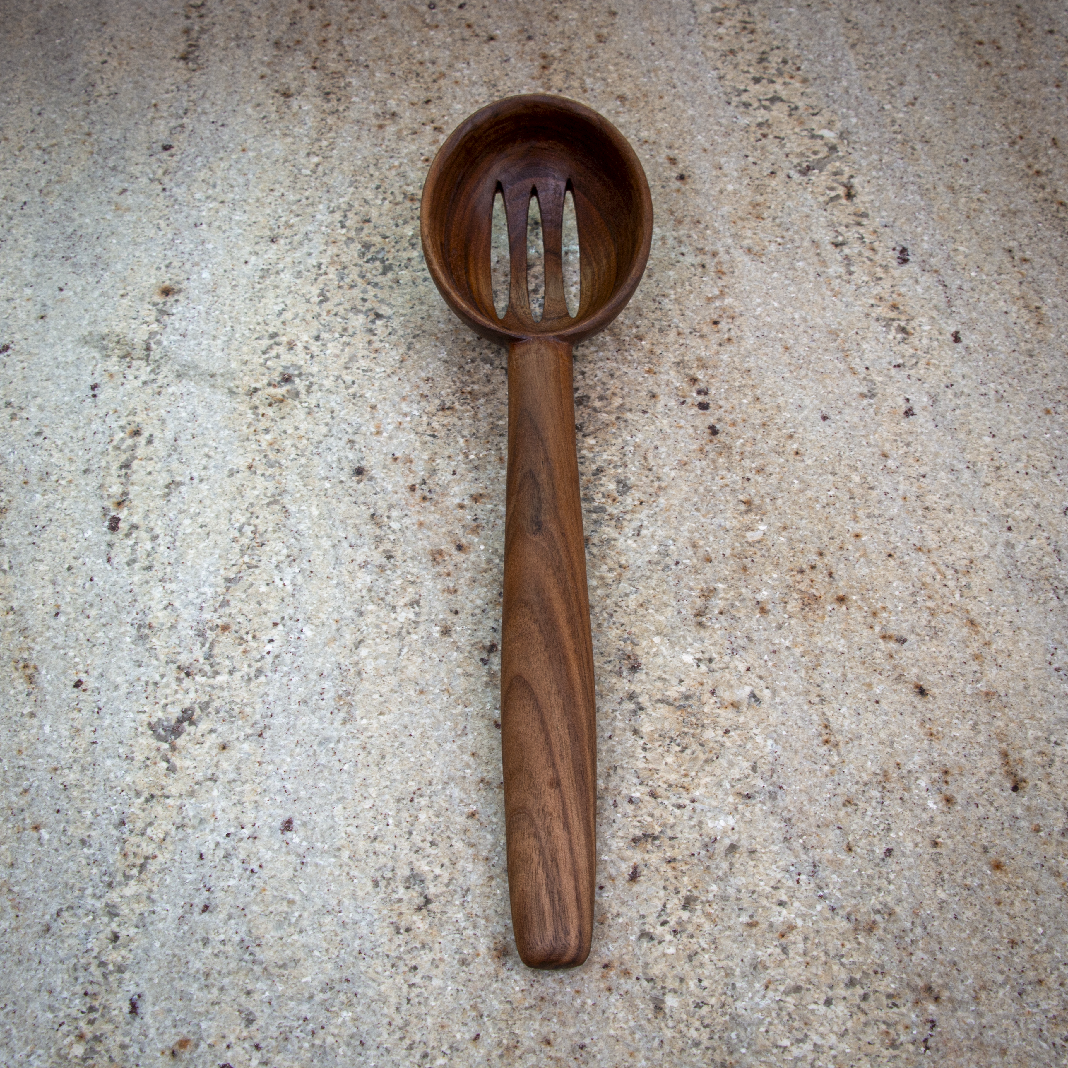 Large slotted wooden cooking spoon for draining and stirring