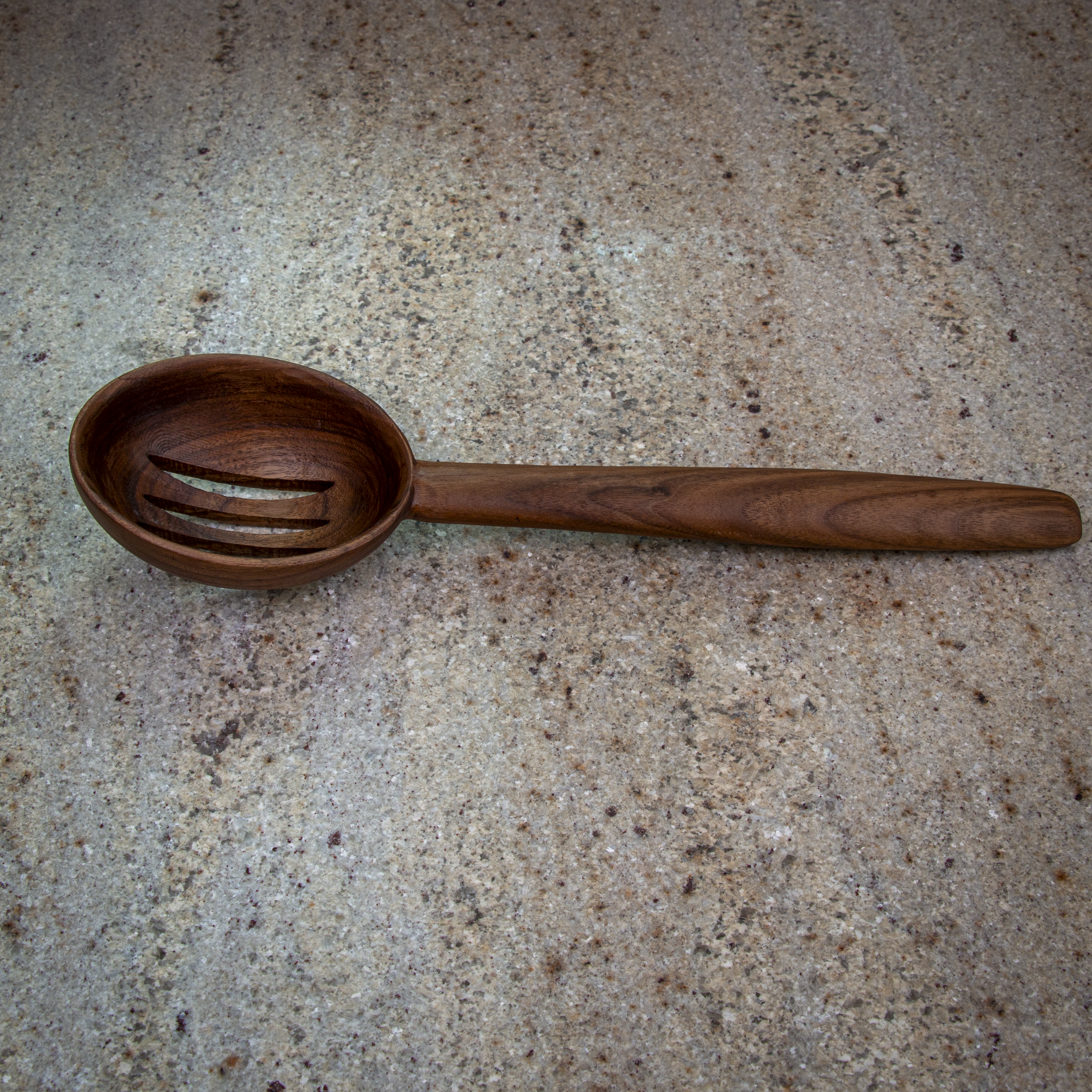 Large slotted wooden cooking spoon for draining and stirring