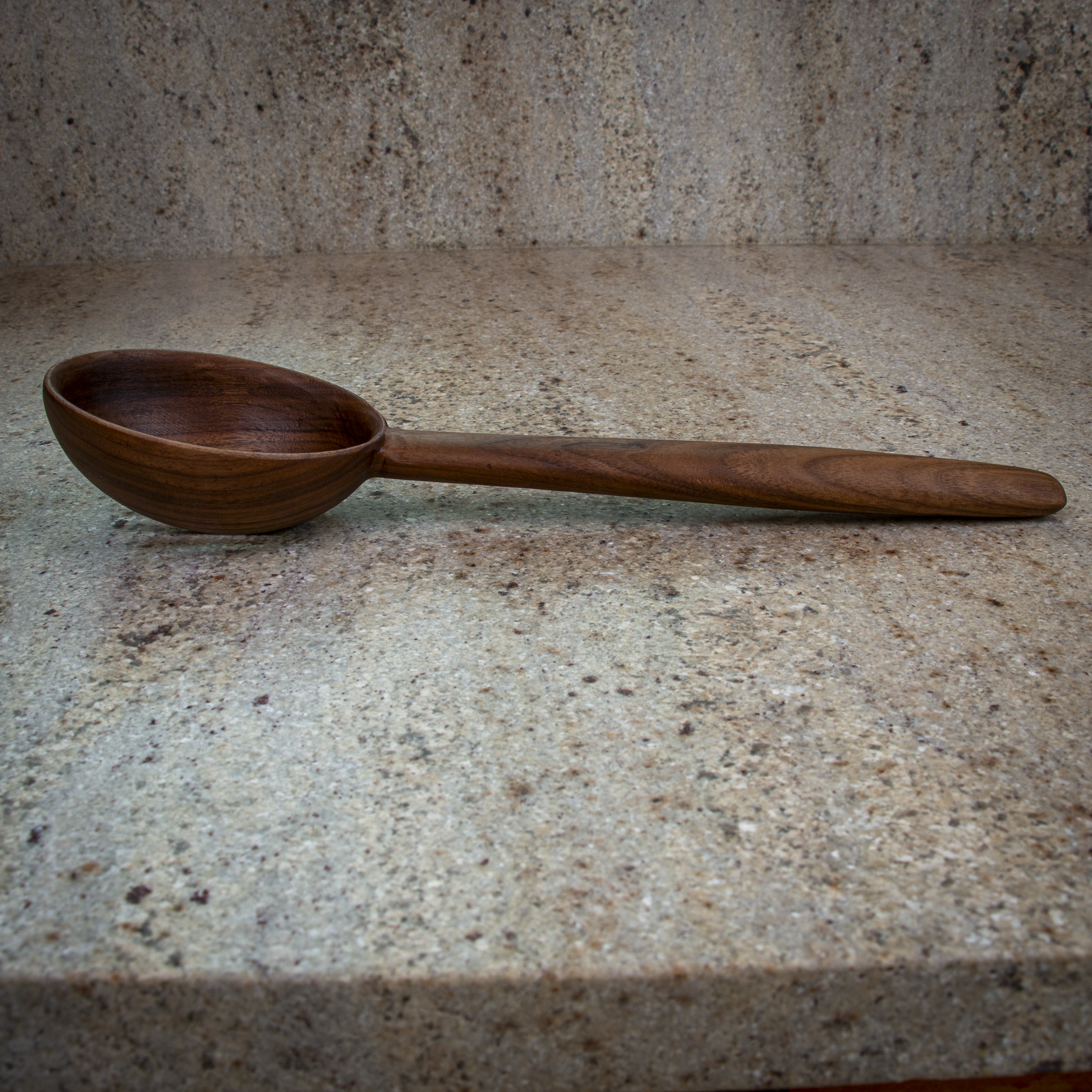 Large slotted wooden cooking spoon for draining and stirring