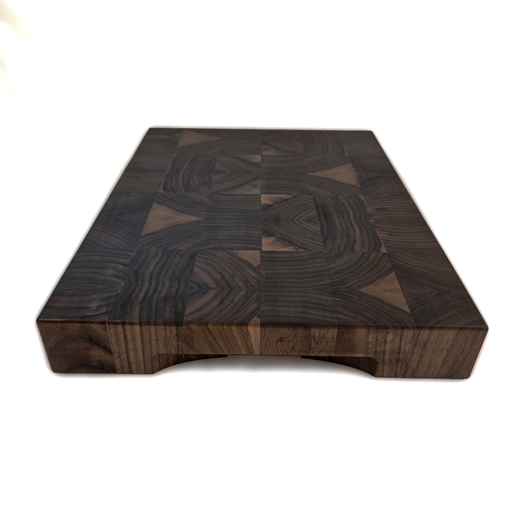 End grain walnut cutting board on countertop for prep and serving